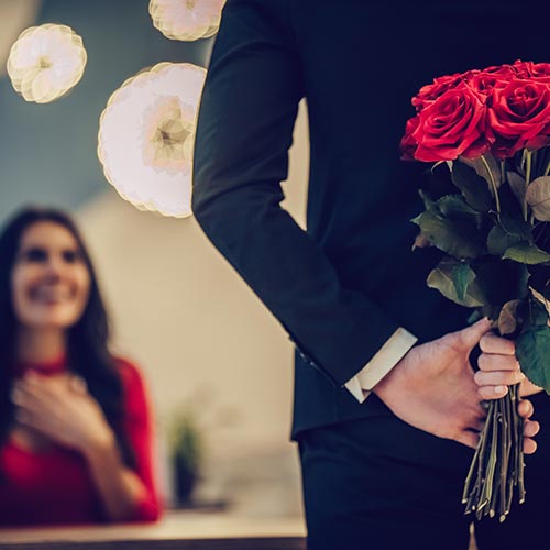 Man Holding Roses behind his back